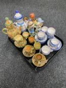 A tray of two continental pottery tea services,