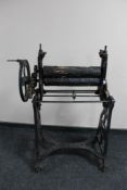 An antique cast iron mangle (a/f)