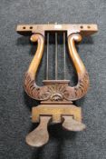 A set of antique mahogany grand piano foot pedals