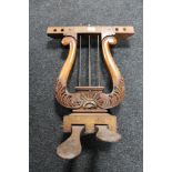 A set of antique mahogany grand piano foot pedals