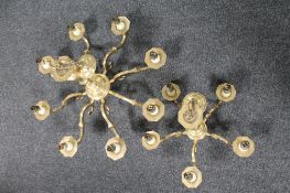 A brass eight branch chandelier with matching five branch chandelier