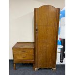 A mid 20th century sentry door wardrobe together with matching two drawer chest