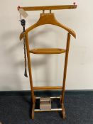 A mid century valet stand together with a tie master roller and shoe horn with jockey head handle