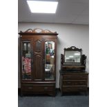 An Edwardian double mirrored wardrobe together with a dressing chest with triple mirror