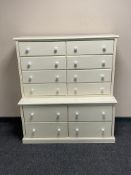 A contemporary painted twelve drawer chest on chest with porcelain handles