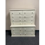 A contemporary painted twelve drawer chest on chest with porcelain handles