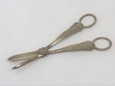 A pair of George V silver candle snuffers,