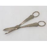 A pair of George V silver candle snuffers,