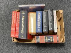 A box of hardback books,