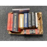 A box of hardback books,