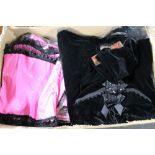 A box of Phaze velvet dresses and pink gloss basques