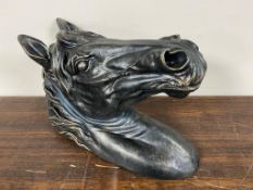 A metal wall mounted horses head