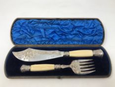 A fine boxed pair of Victorian silver and ivory fish servers, Sheffield 1879.