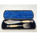 A fine boxed pair of Victorian silver and ivory fish servers, Sheffield 1879.