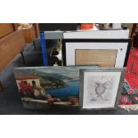 A draughtsman's drawing board, framed prints,