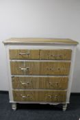 An antique painted pine five drawer chest