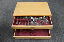 A 20th century three drawer canteen chest containing a part set of silver plated cutlery