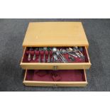 A 20th century three drawer canteen chest containing a part set of silver plated cutlery