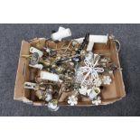 A box of metal light fittings together with a fringed woollen rug
