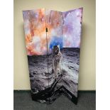 A three way folding room divider depicting Neil Armstrong on the moon