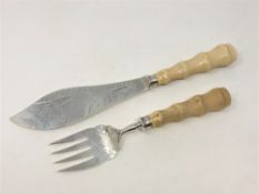 A fine pair of Victorian silver and ivory fish servers, Harrison & Howson, Sheffield 1880,