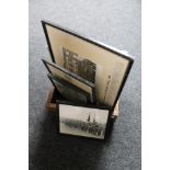 A wooden box containing black and white military photographs