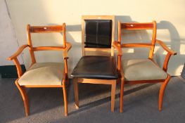 A pair of inlaid yew wood armchairs together with a contemporary pine vinyl upholstered dining