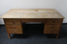 A mid century teak twin pedestal desk