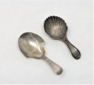 A Georgian silver caddy spoon and a Victorian example (2) CONDITION REPORT: 23.