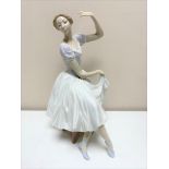 A Lladro figure - Female dancer seated