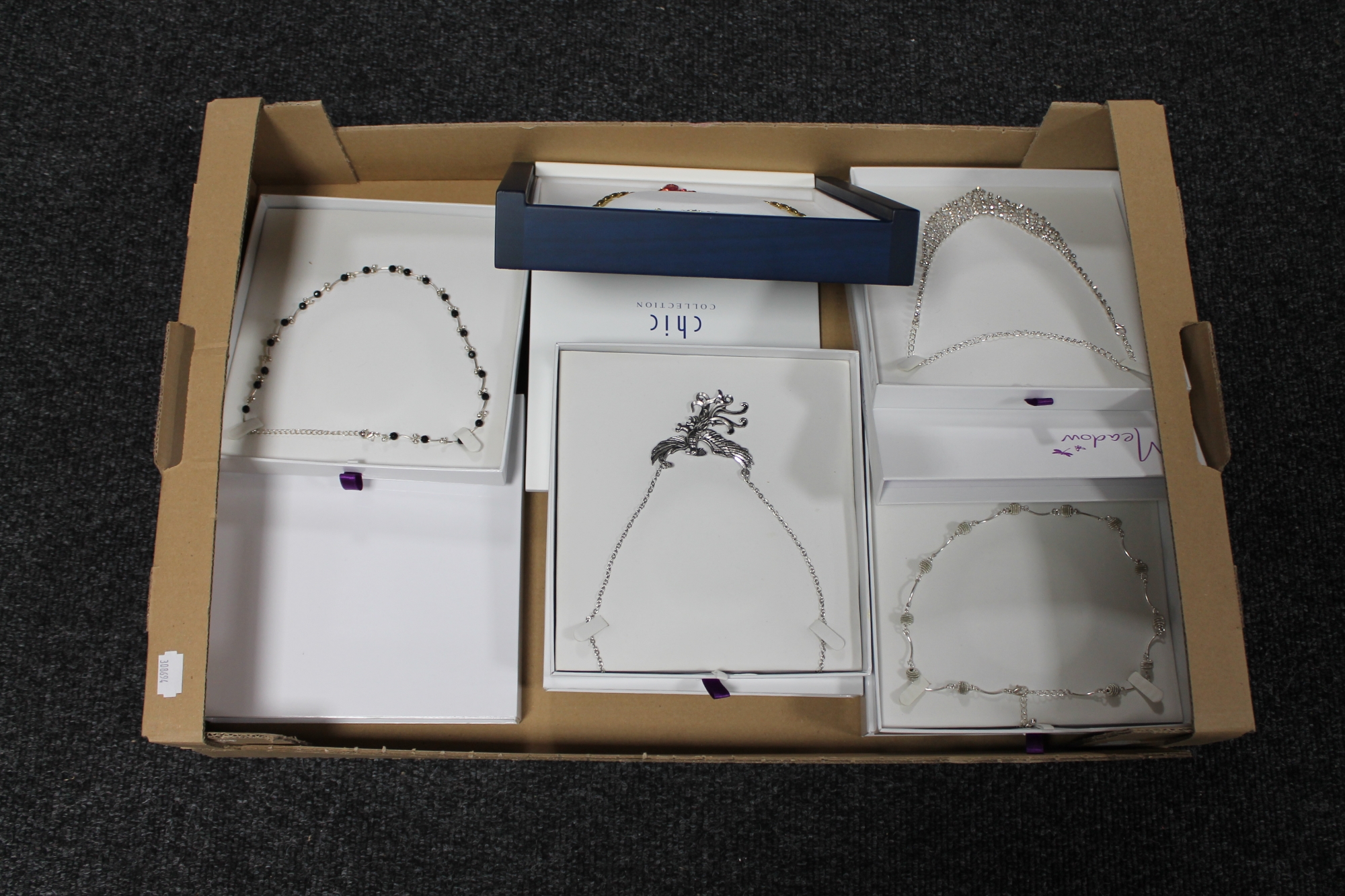 A box of five costume necklaces