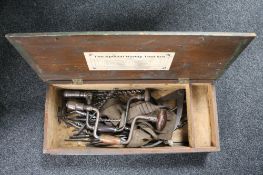 A vintage wooden tool box, hand tools including drill bits,
