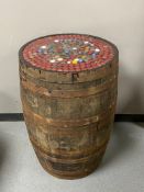 An oak coopered whisky barrel with bottle top lid