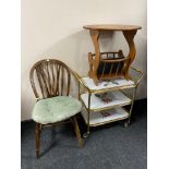 A Windsor kitchen dining chair together with a gilt three tier serving trolley and a magazine table