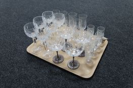 A tray of assorted lead crystal drinking glasses including champagne,
