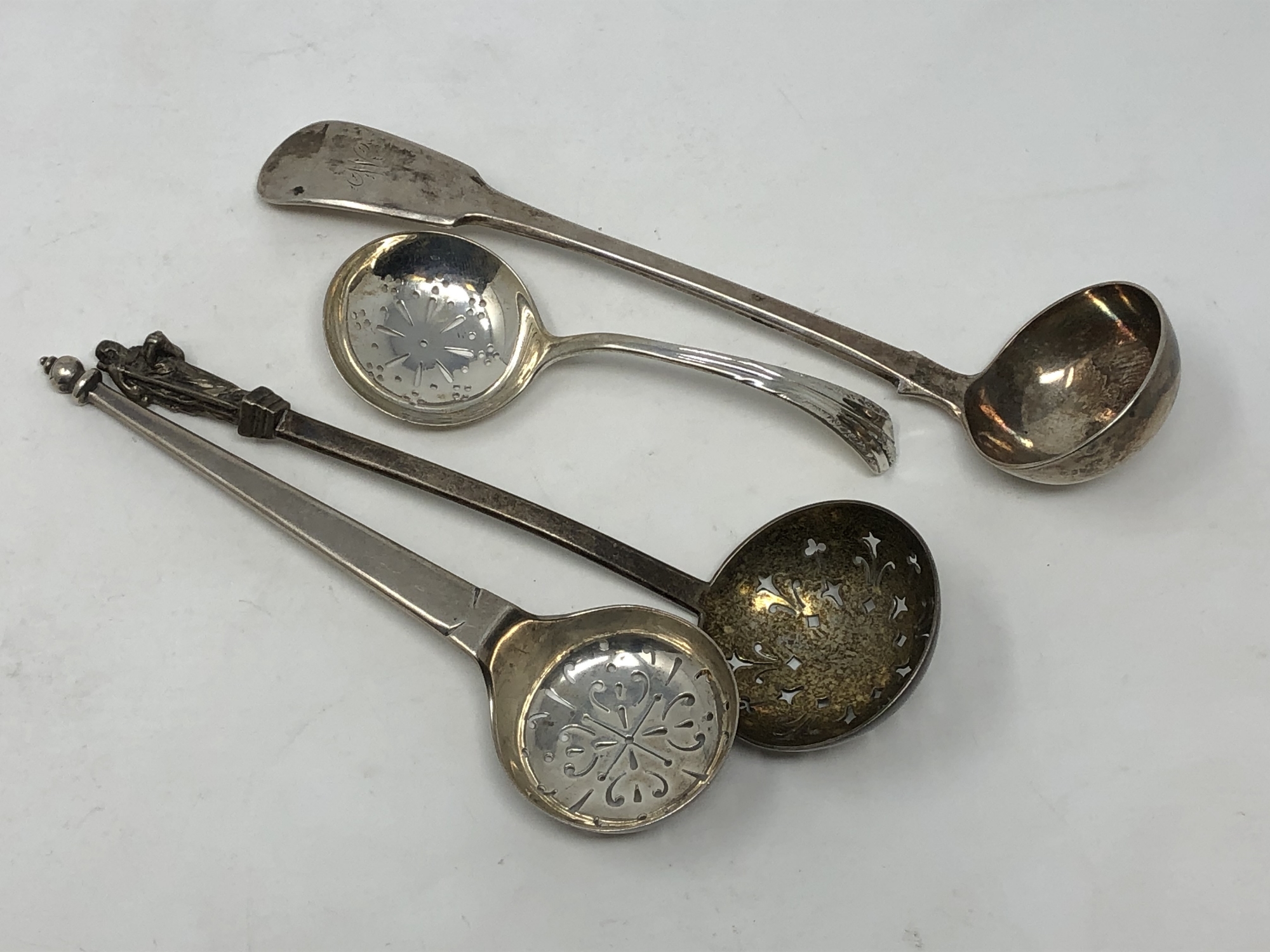 Four Georgian/Victorian silver sifting spoons,