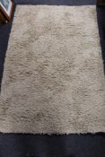 A contemporary tufted woolen rug