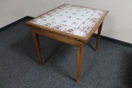 An early 20th century tiled top table