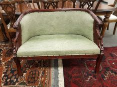 A carved mahogany two seater salon settee,