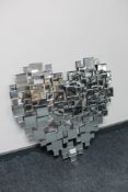 A contemporary all glass cubed heart shaped mirror