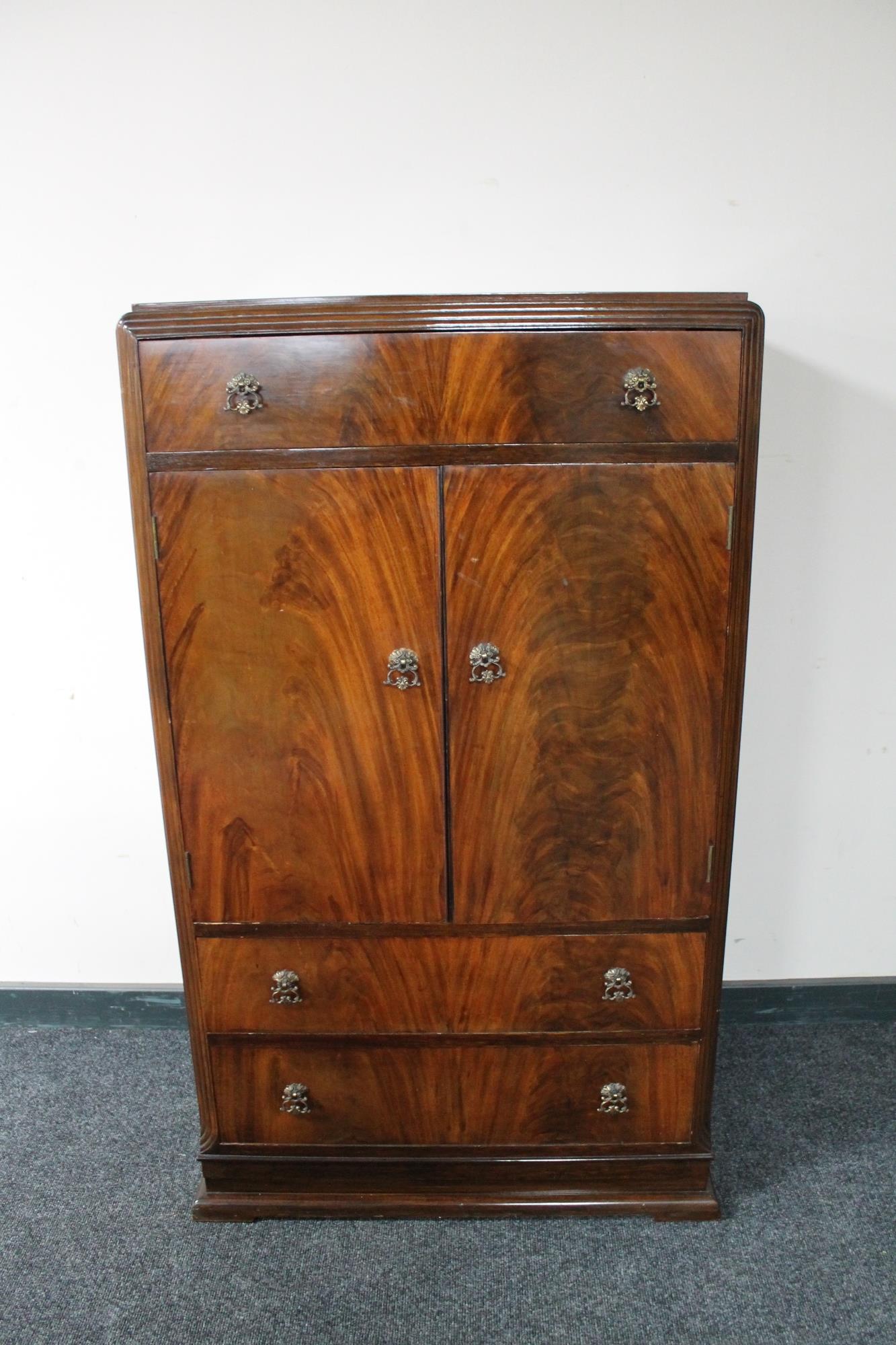 A 1930's mahogany linen cabinet