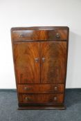 A 1930's mahogany linen cabinet