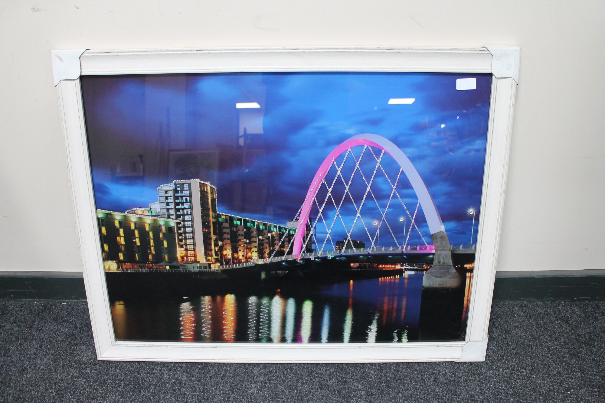 A framed photograph of a bridge with glitter decoration