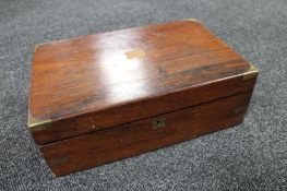 A Victorian rosewood writing box with brass mounts