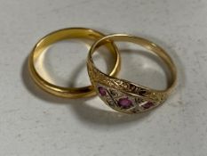 An 18ct gold wedding band and a 9ct gold dress ring