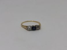 A yellow gold two stone diamond and sapphire ring,