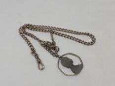 A silver pocket watch chain with T-bar and pierced 50p piece,