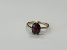 A 9ct gold garnet ring, size N1/2 CONDITION REPORT: 1.