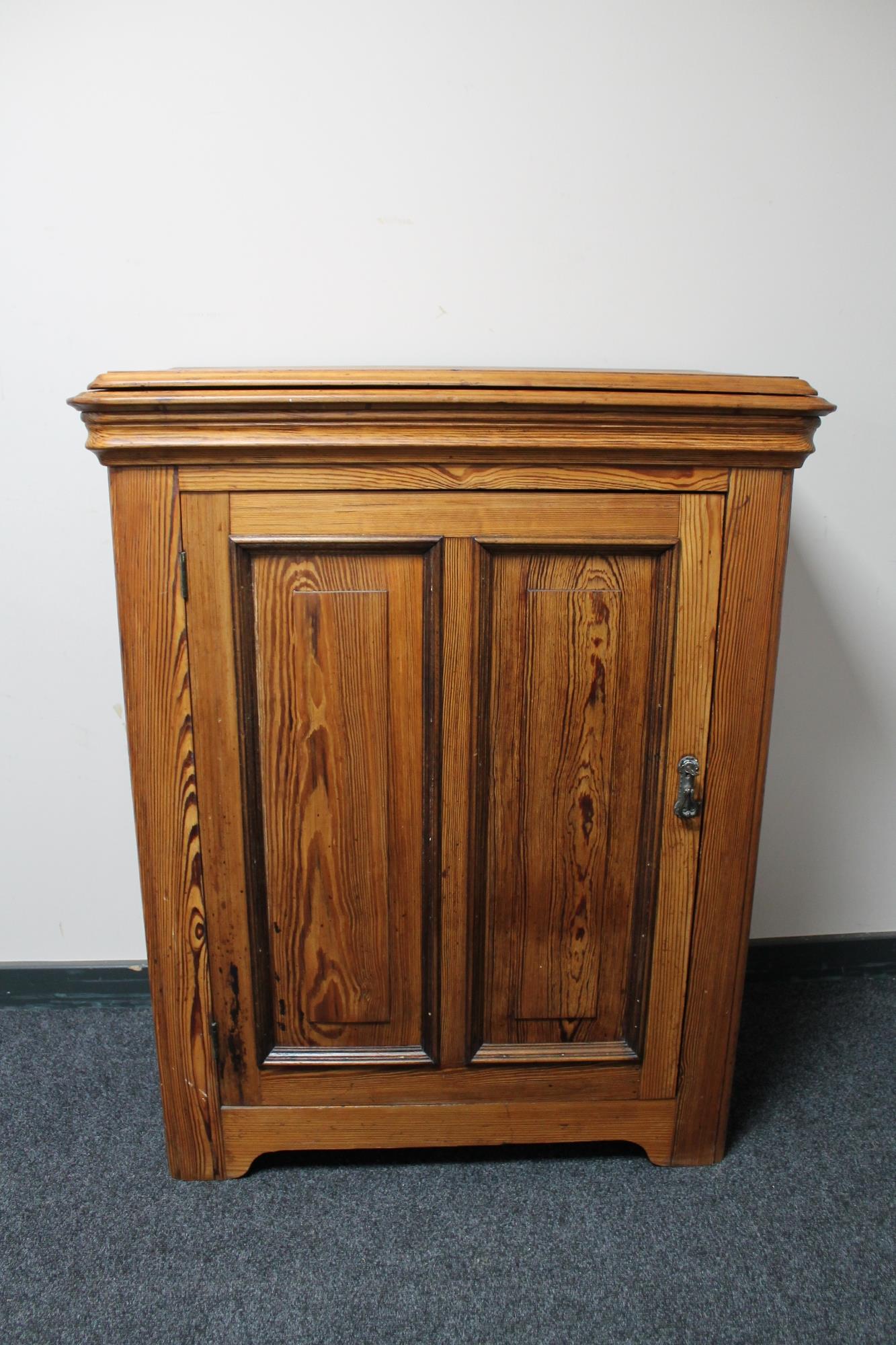 An antique pitch pine cabinet