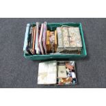 A box of books relating to needlework, quilt making and dressmaking, assorted knitting needles,